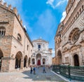 Tourists in Pizza Doumo.Basilica of Santa Maria Maggiore,Cappella Colleoni and Cathedral in Citta Alta on a sunny day