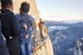 Tourists on the Plank Walk in the Sky at the sunset, worlds most dangerous hike.