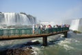 tourists on platform in waters of Iguacu river, at Iguacu falls, Brazil Royalty Free Stock Photo