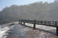 tourists on platform in waters of Iguacu river, at Iguacu falls, Brazil Royalty Free Stock Photo