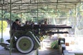 Tourists play cannon in battlefield tourist park