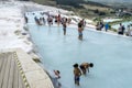 Tourists play in one of the thermal pools at Cotton Castle in Turkey.