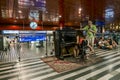 Tourists play the piano in the lobby of the Main Train station in Prague