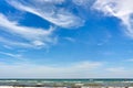 Tourists playing in Baltic sea during summer vacations