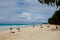 Tourists playing on wide sand coastline at Boracay Island, Philippines