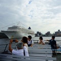 Tourists on pleasure boat. Big cruise ship. Osanbashi Pier main international passenger Royalty Free Stock Photo