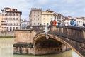 Tourists on Ponte Santa Trinita over Arno river Royalty Free Stock Photo