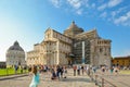 Tourists pose in front of the Pisa Duomo cathedral in the main piazza near the Leaning Tower in Pisa, Italy Royalty Free Stock Photo