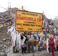 Tourists posing at Khardungla Top, world`s highest motorable road Royalty Free Stock Photo