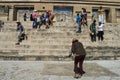 Tourists are posing for photos in front of the main pyramid at t