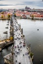 Tourists at Prague Charles Bridge. Prague with Vltava river. Cityscape with mass tourism