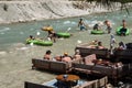 Tourists prepare to enter the whitewater