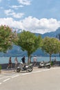 Tourists on the promenade on the shore of Lake Garda, Lago di Garda, in Limone Sul Garda Royalty Free Stock Photo