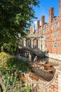 Tourists on punt trip along River Cam near Bridge of Sighs of St