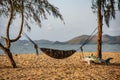 Tourists put their hammocks and put them on the beach to lie down at the beach in Sattahip District Royalty Free Stock Photo