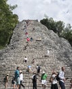 Tourists at the Pyramid Nohoch Mul of the Mayan Coba Ruins, Mexico