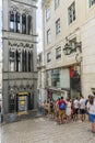 Tourists queue to take the elevator to the Lisbon metro