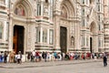 Tourists queued in a line waiting for entry into the Il Duomo church