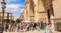 tourists queuing to enter the Notre Dame Cathedral in Paris, France Royalty Free Stock Photo