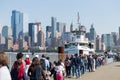 Tourists queuing to Miss Liberty boat in Battery Park. Royalty Free Stock Photo