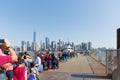 Tourists queuing to Miss Liberty boat in Battery Park. Royalty Free Stock Photo