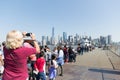 Tourists queuing to Miss Liberty boat in Battery Park.