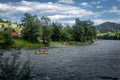 Tourists rafting on Dunajec river in Szczawnica, Pieniny mountains, Poland.