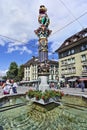 Tourists reading map at water well, Bern, Switzerland Royalty Free Stock Photo