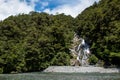 Tourists refreshing at the Frantail Falls, Mount Aspiring National Park Royalty Free Stock Photo