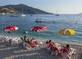 Tourists relax on the beach at Kalkan in Turkey in the late afternoon.