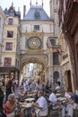 Tourists relax in a cafe on the Great Clock in the center of Rouen