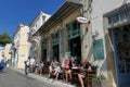 Tourists relax at the historic Asticon bar in Potamos, Greece