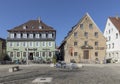 tourists relax at the town central square of Weikersheim along the romantic road