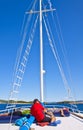 Tourists relax on the upper deck of a cruise ship