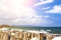 Tourists relaxing on Beach with views along coastline, Crete, Greece, Europe