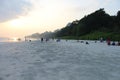 Tourists relaxing and enjoying the sunset at Radhanagar Beach, Havelock Island