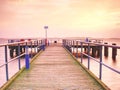 Tourists resort, pier above silent smooth water Royalty Free Stock Photo