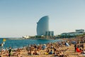 Tourists rest along Barceloneta beach. Barcelona, Spain - May 2019 Royalty Free Stock Photo