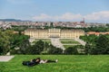 Tourists rest on the background the Schonbrunn Palace, Vienna