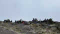 Tourists rest on the rocks. Climbing Kilimanjaro, Africa. Beautiful mountain landscape. The amazing nature of Tanzania