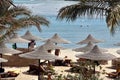 Tourists are resting on the beach of the Red Sea. Tourists back to egypt resorts Royalty Free Stock Photo