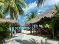 Tourists resting at cafes in national style on Palancar beach, Cozumel island in Mayan Mexico Royalty Free Stock Photo