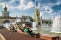 Tourists are resting near the Stone Flower Fountain in Moscow