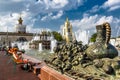 Tourists are resting near the Stone Flower Fountain in Moscow