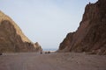 Tourists ride ATV through the picturesque places of Dahab, South Sinai Governorate, Egypt Royalty Free Stock Photo