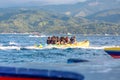 Tourists ride a Banana Boat on Boracay sea Royalty Free Stock Photo