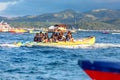 Tourists ride a Banana Boat on Boracay sea Royalty Free Stock Photo