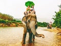 Tourists ride elephant in Thailand