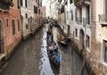 Tourists ride gondolas tour in Venice