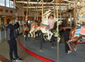 Tourists ride at historical B&B carousel at Coney Island Boardwalk in Brooklyn.